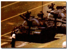 Student in Tiananmen Square stopping a row of tanks